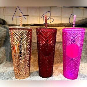 3 different color Starbucks tumblers